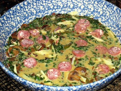 A sliced sausage added to the quiche.