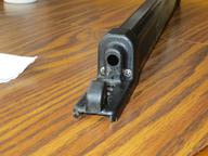 bottom of latch assembly showing two screws to remove