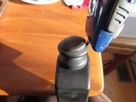 gently prying the cover off the knob with a knife blade